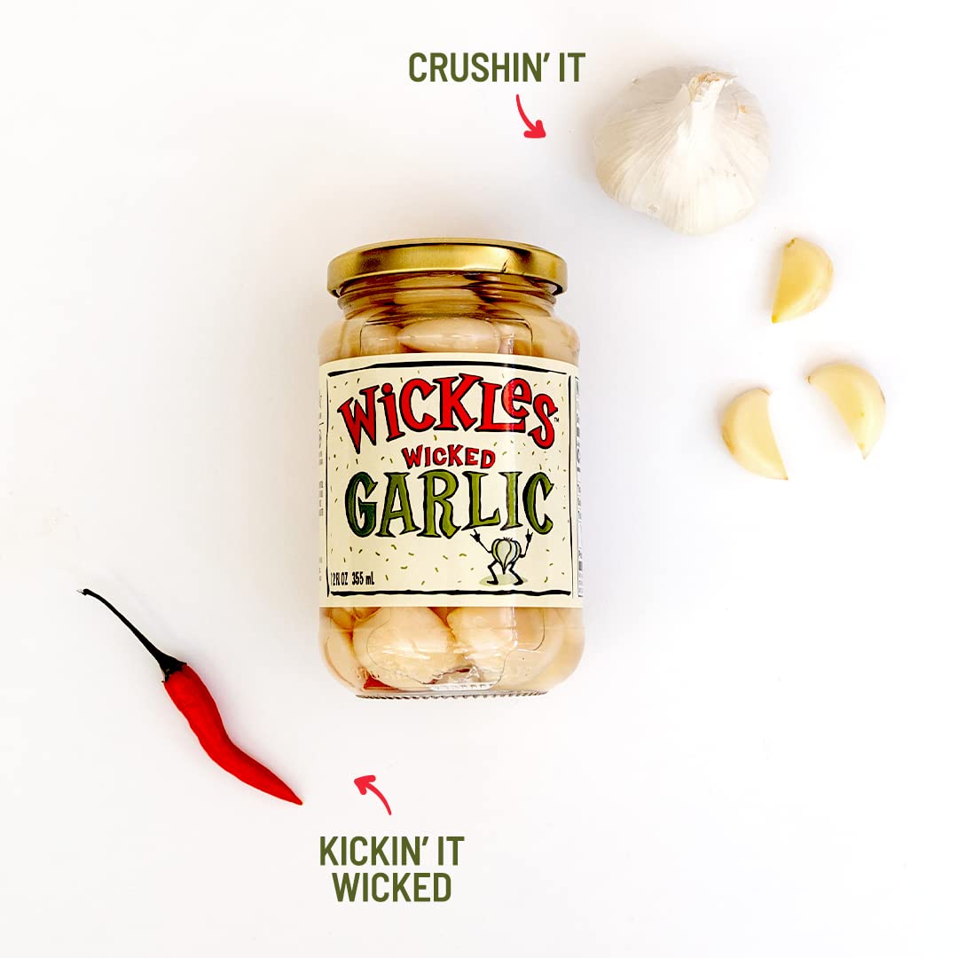 Jar of Wickles Wicked Garlic with garlic cloves and a red chili pepper on a white background.