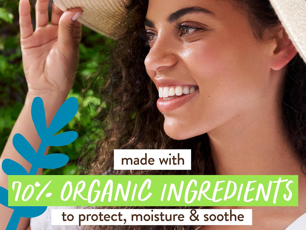 Woman with a sun hat, smiling outdoors with text about organic ingredients.