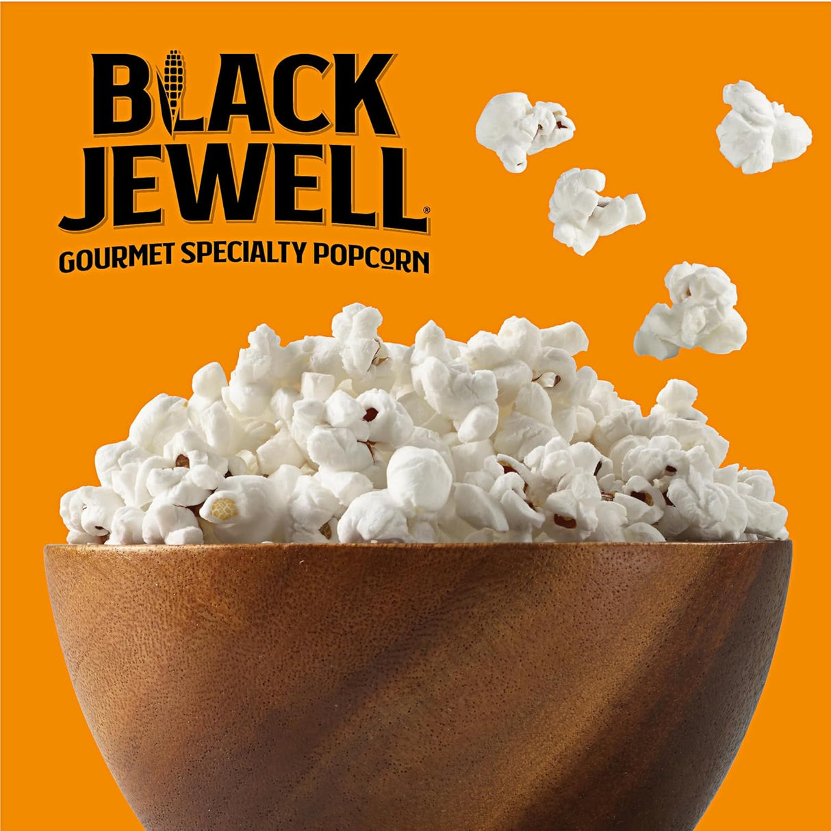 Bowl of popcorn with 'Black Jewell' brand name on an orange background