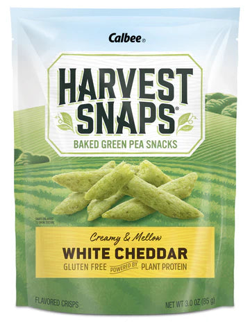 Calbee Harvest Snaps Baked Green Pea Snacks packaging with green field background