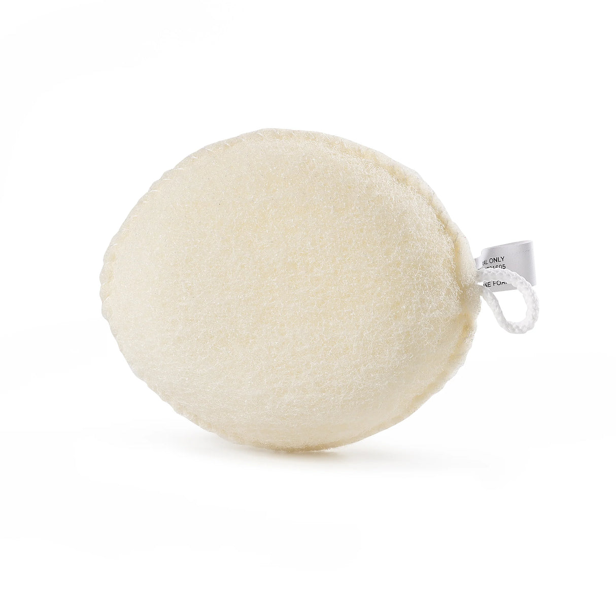 Round beige bath sponge with a brand tag on a white background