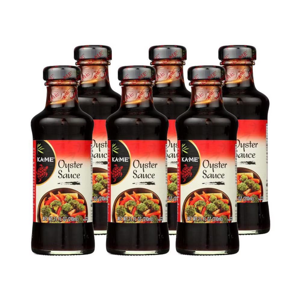 Six bottles of Kame Oyster Sauce on a white background
