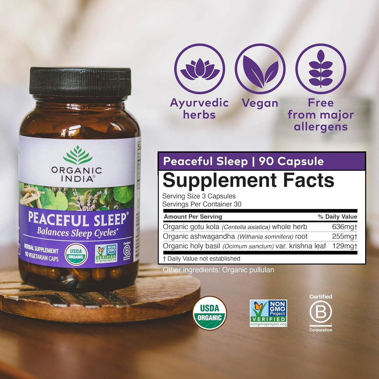 Supplement bottle labeled 'Peaceful Sleep' by Organic India on a wooden surface with product details.