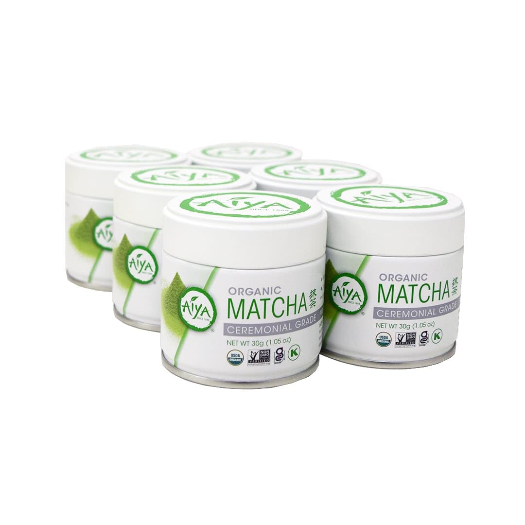 six containers of AIYA Organic Matcha on a white background