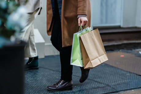 person using biodegradable shopping bag sustainable tableware