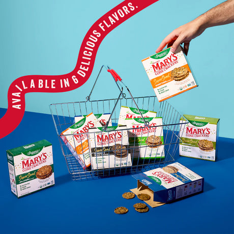 Basket filled with various boxes of Mary's Gone Crackers on a blue background