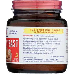 Jar of yeast with a red lid and label on a white background