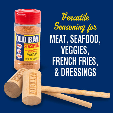 Old Bay seasoning bottle with wooden mallets on a blue background