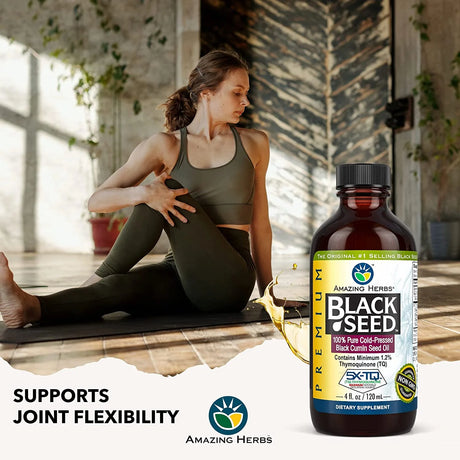 Woman stretching on a mat with a bottle of Amazing Herbs Black Seed oil in the foreground.