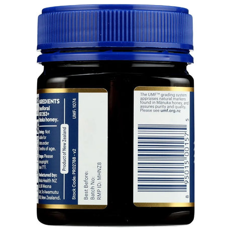 Back view of a UMF honey bottle with blue cap and labels.