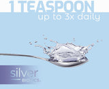 Spoon with liquid splashing out against a light blue background, featuring 'Silver Biomics' branding.