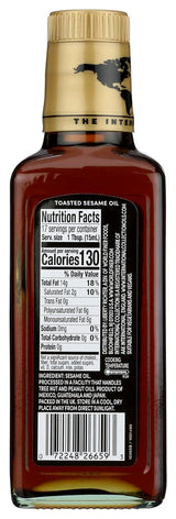 Bottle of toasted sesame oil with nutrition label on a white background
