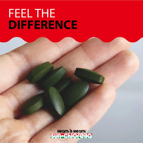 Hand holding green pills with 'Feel the Difference' text and Sun-Chlorella logo.