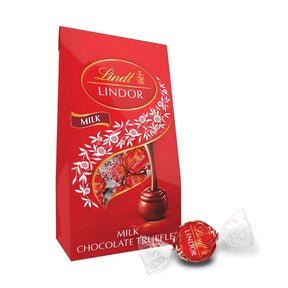 Red Lindt Lindor milk chocolate truffle packaging with a single truffle on a white background