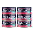 Four cans of Safe Catch pink salmon on a white background