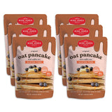 Multiple packages of Miss Jones Baking Co. oat pancake and waffle mix on a white background