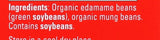 Red label with white text listing ingredients on a product packaging.