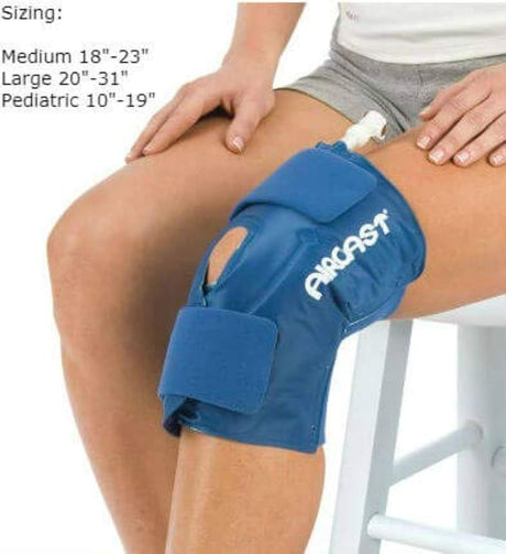 Blue knee brace on a person's knee with sizing information displayed.