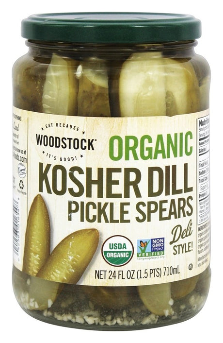 Jar of Woodstock Organic Kosher Dill Pickle Spears with a green lid on a white background