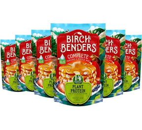 6 packages of Birch Benders Complete Pancake and Waffle Mix with plant protein on a white background.