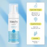 Honey Pot Sensitive Foaming Wash bottle with ingredients listed on a blue gradient background