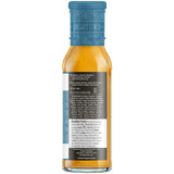 Bottle of salad dressing with blue label on a white background