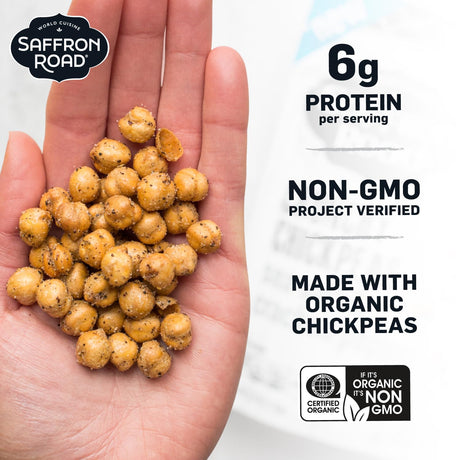 Hand holding chickpeas with Saffron Road branding and nutritional information on a white background