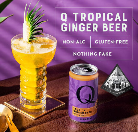 Q Tropical Ginger Beer can with a glass of ginger beer garnished with a pineapple on a purple background.