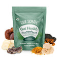 Four Sigmatic Gut Health mushroom blend package with mushrooms displayed on a white background