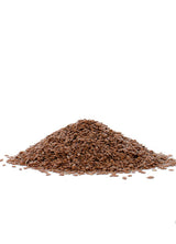 Pile of brown flaxseeds on a white background