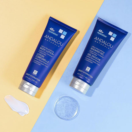 Two Andalou Naturals skincare products on a split beige and blue background