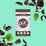 Packaging of pur gum with chocolate mint flavor on a teal background with chocolate pieces and mint leaves.
