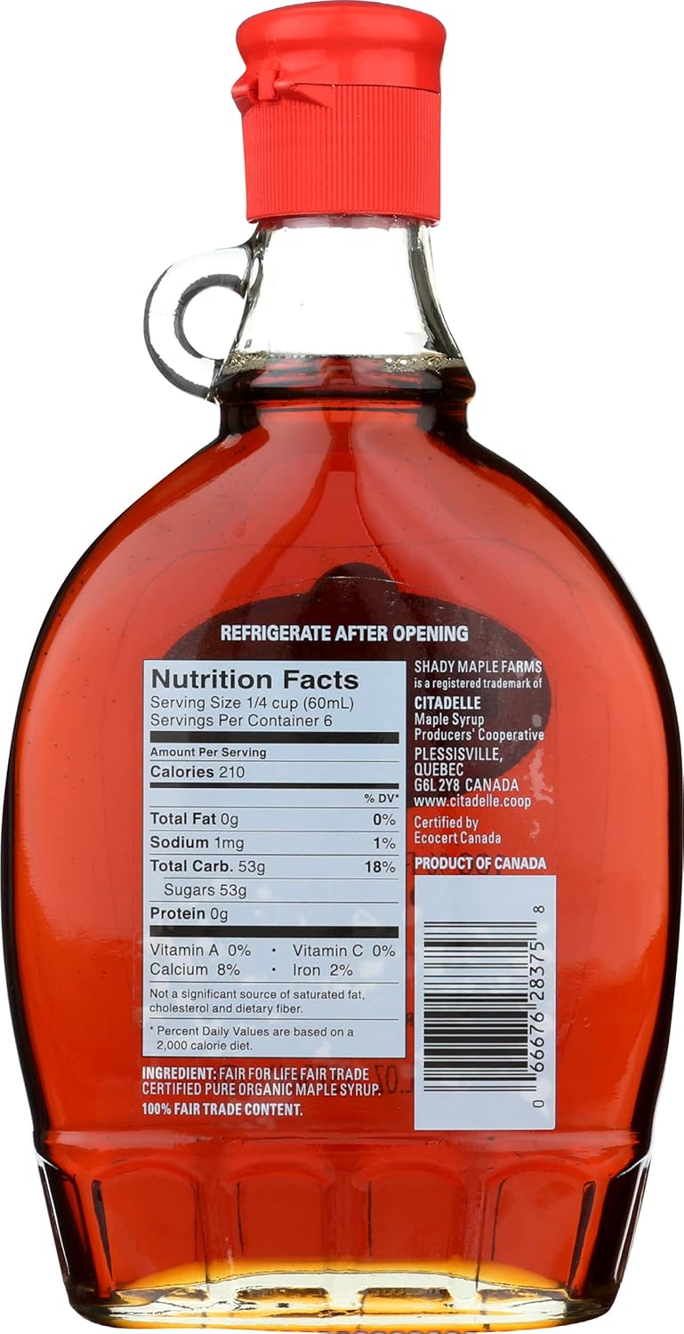 Bottle of maple syrup with nutrition facts label on a white background