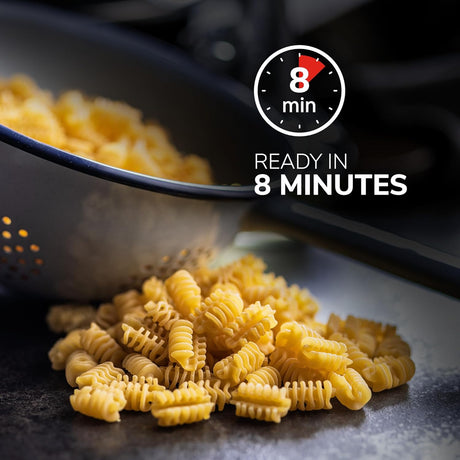 Cooked pasta on a dark surface with a colander and text indicating 'Ready in 8 Minutes'.