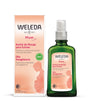 Weleda massage oil bottle and packaging on a white background