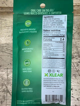Green package of Xlear with nutritional information on a wooden surface