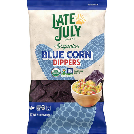 Bag of Late July Organic Blue Corn Dippers with tortilla chips and dip on a white background