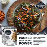 Saffron Road salad with chickpeas and kale on a wooden board, accompanied by packaging and text about plant-based nutrition.