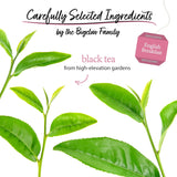 Tea leaves with Bigelow English Breakfast tea packaging on a white background