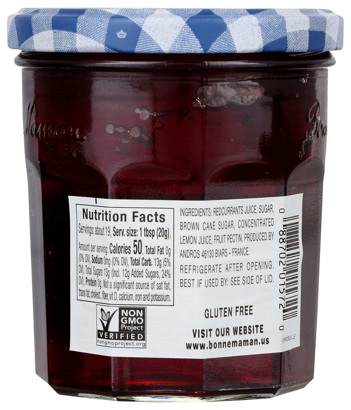 Jar of jam with a blue checkered lid, showing a nutrition facts label.