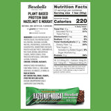 Nutrition label and Hazelnut Nougat Barebells protein bar on a white background with green border