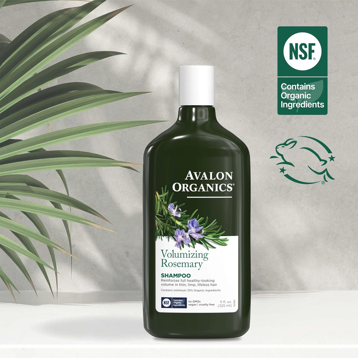 Avalon Organics Volumizing Rosemary Conditioner bottle with green leaves and NSF certification logo on a light gray background.