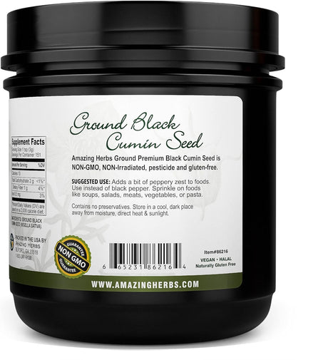 Black container of ground black cumin seed with label on a white background