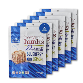 Six packages of Heavenly Hunks Driizzle Blueberry Lemon snack bites on a white background