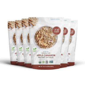 Multiple packages of Apple Cinnamon Instant Oatmeal with visible branding on a white background