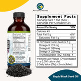 Bottle of Liquid Black Seed Oil with supplement facts label on a white background