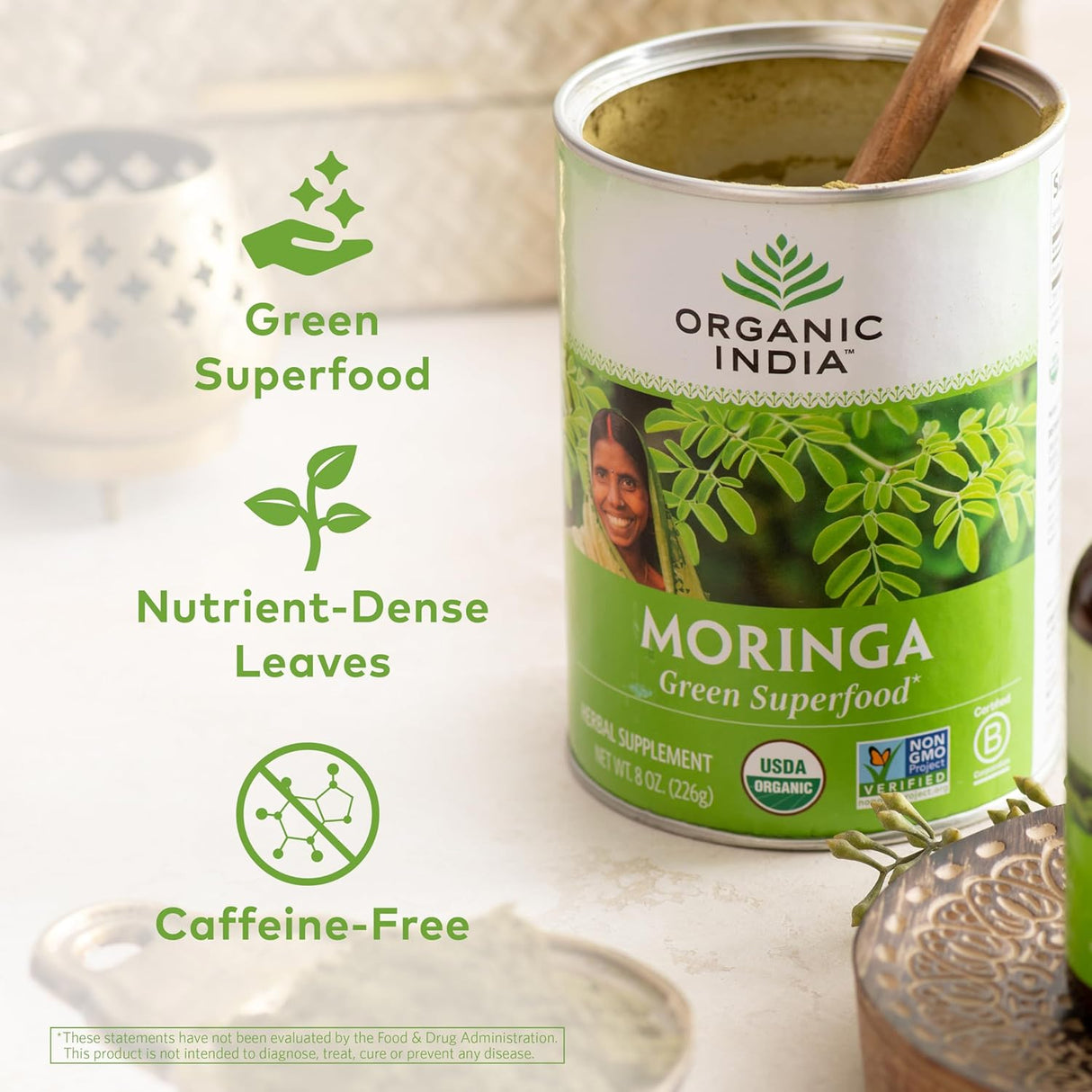 Can of Organic India Moringa superfood with branding and product details on a light background