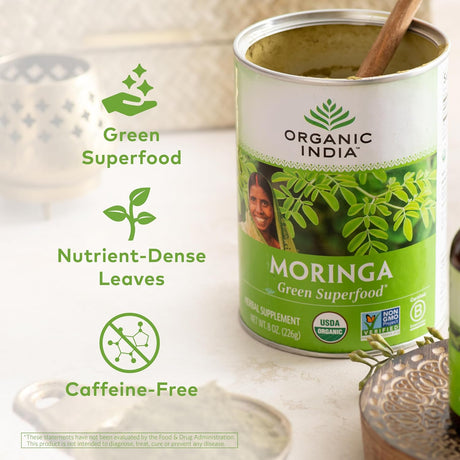 Can of Organic India Moringa superfood with branding and product details on a light background