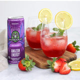 Sambazon Amazon Energy drink can with two glasses of red juice garnished with lemon slices and strawberries on a white background.