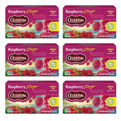 Six boxes of Celestial Seasonings Raspberry Zinger Herbal Tea on a white background